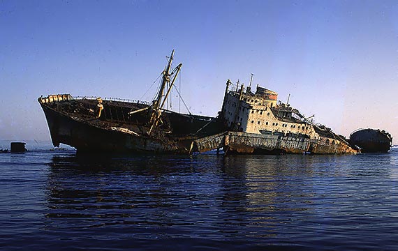Lullia, rusting ship, washed up on a coral reef